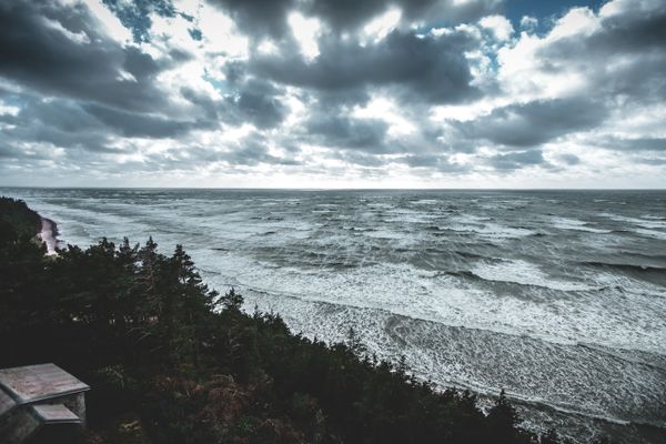 Baltic sea coastline under heavy cloud — photo by Mareks Steins on Pexels