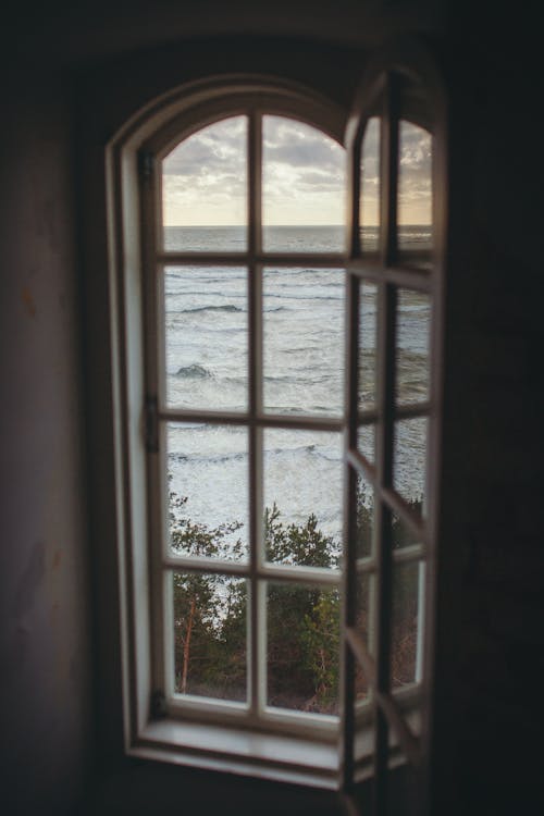 Photo of a Window Overlooking the Ocean