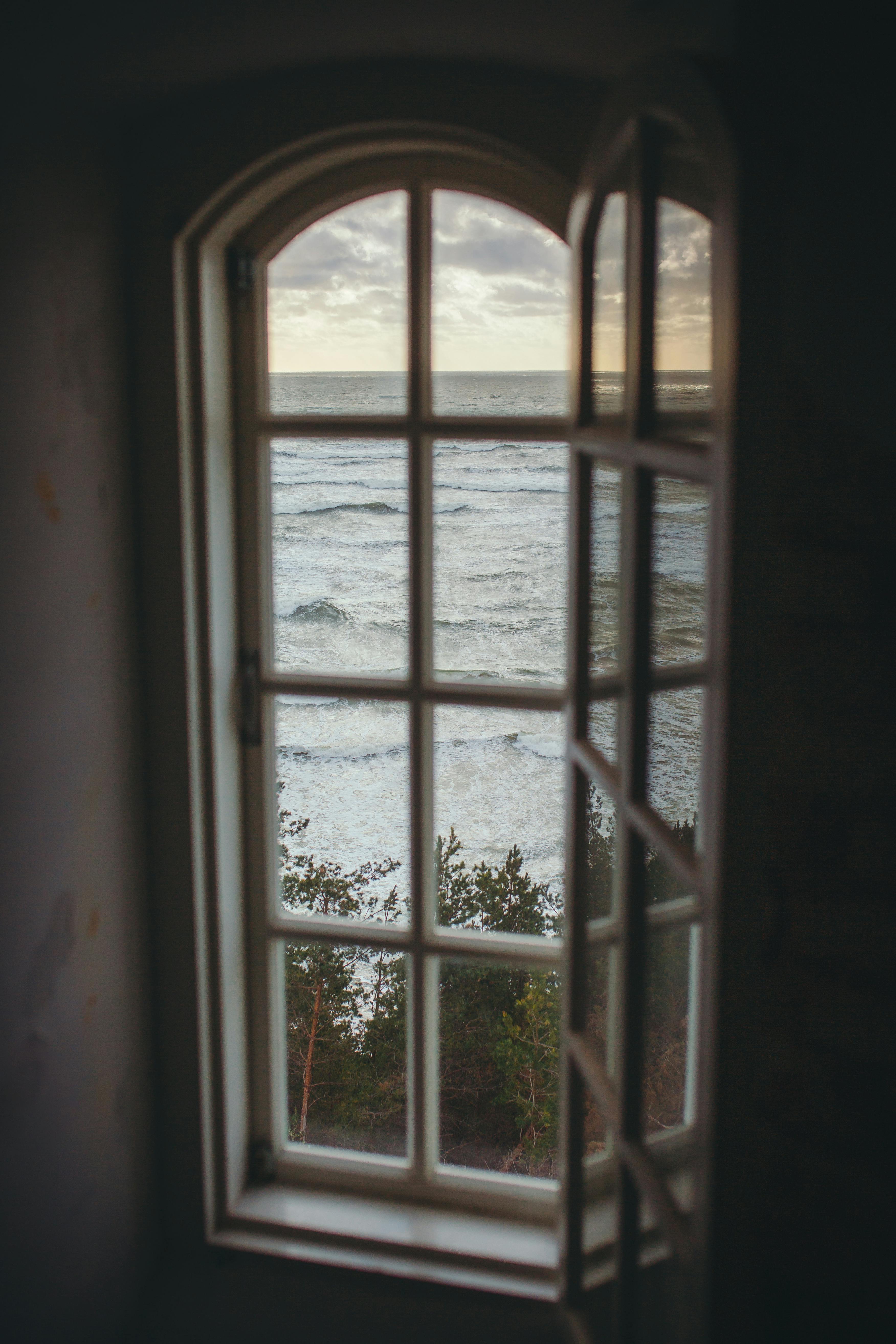 Photo of a Window Overlooking the Ocean