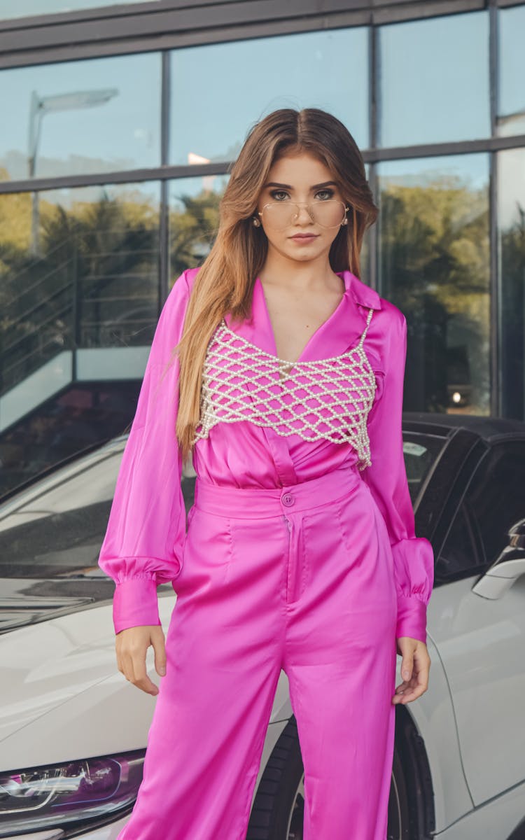 Stylish Woman In Pink Suit Posing Near Car