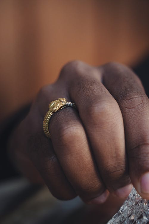 Hand with Golden Snake Ring