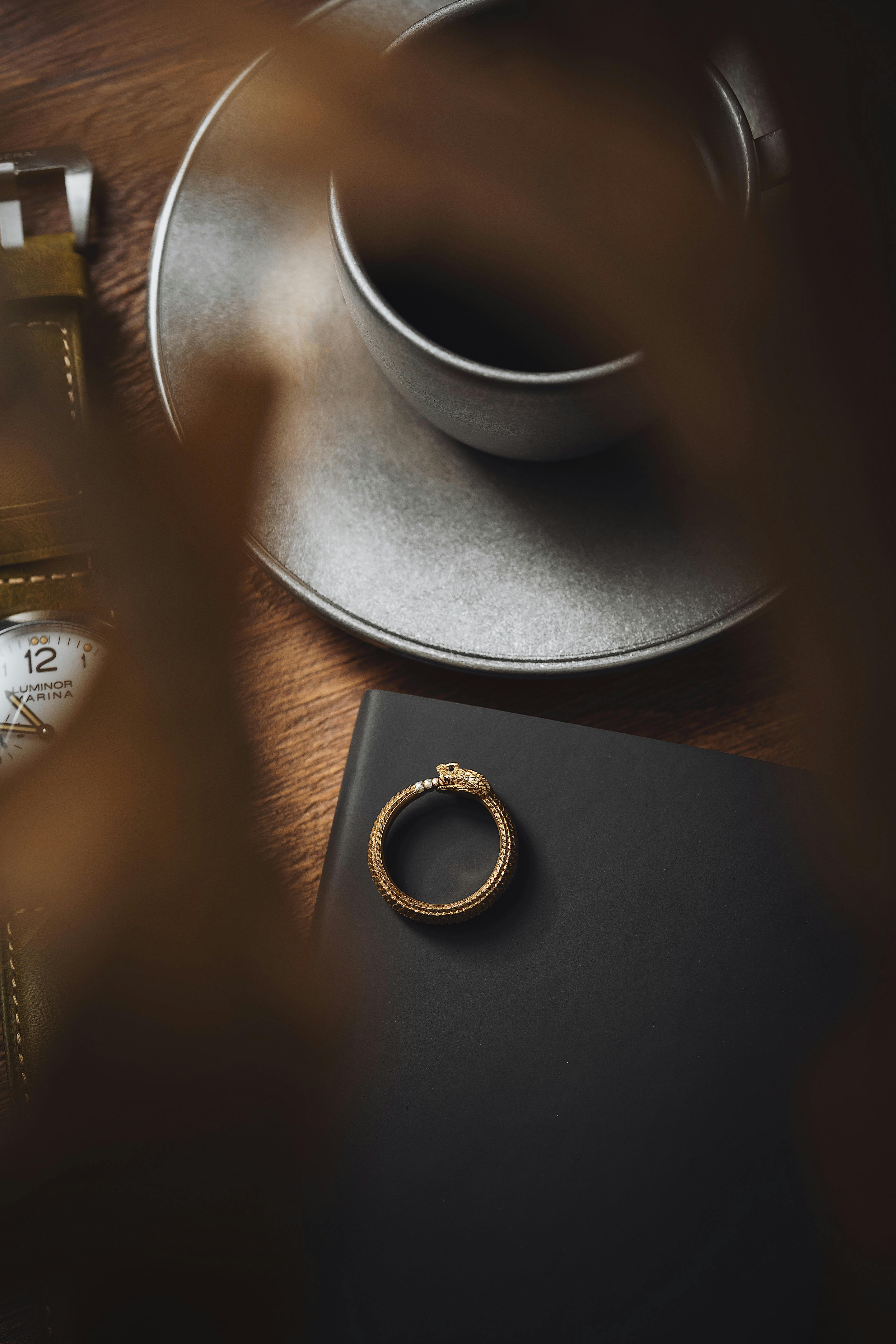 Golden Ring by Coffee Cup on Table · Free Stock Photo, image size:4672x7008