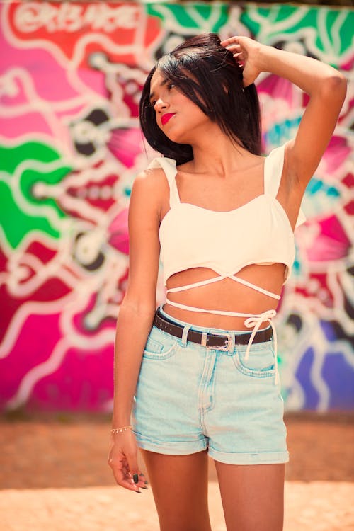 Portrait of Woman with Graffiti on Wall behind