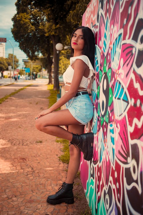 Woman Standing by Wall with Graffiti