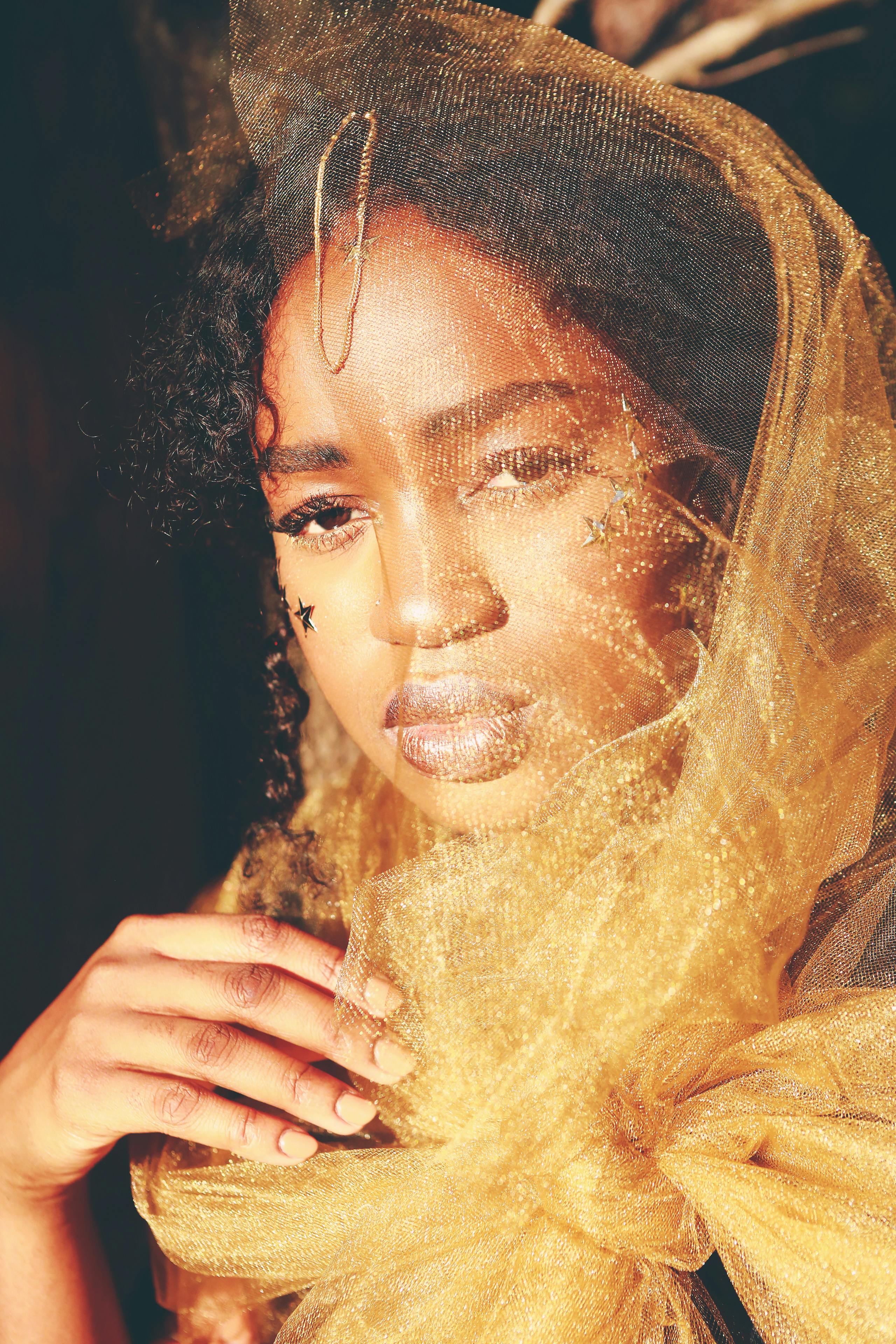 woman wearing brown headdress