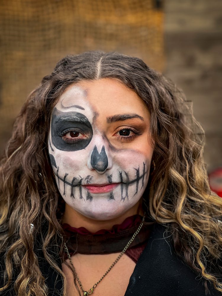 Portrait Of Young Woman With Scary Painting On Face