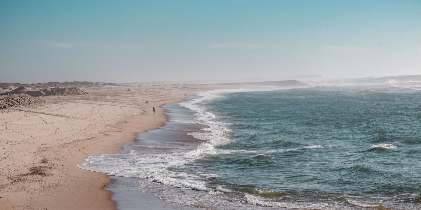 Empty Atlantic beach on Portugal's Alentejo coast near Comporta at sunset