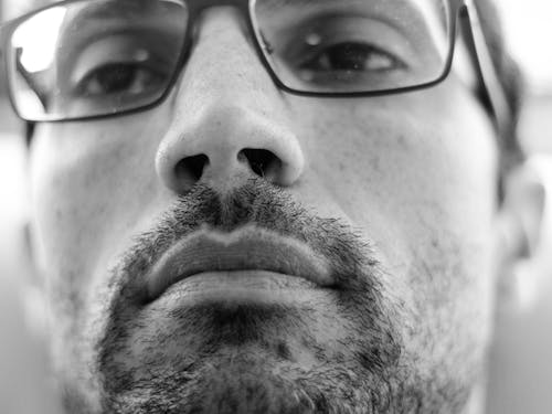 Grayscale Photo of Man in Eyeglasses