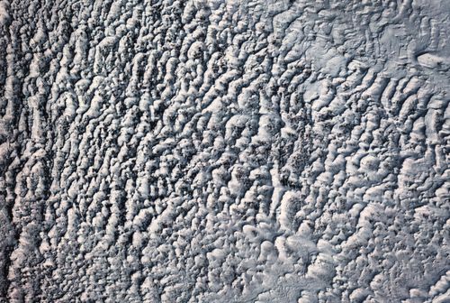 Free Aerial view of a textured snowy landscape in Minnesota during winter, creating abstract patterns. Stock Photo