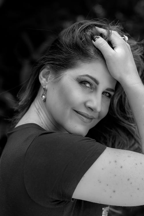 Black and White Portrait of a Brunette Woman Looking over her Shoulder