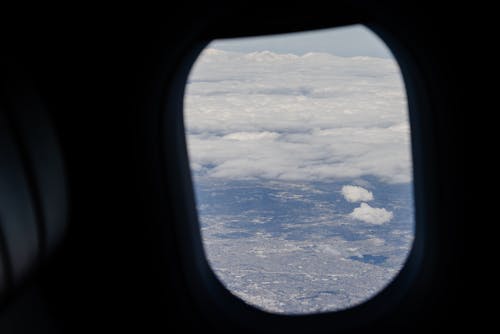 Foto profissional grátis de aeronave, céu, janela