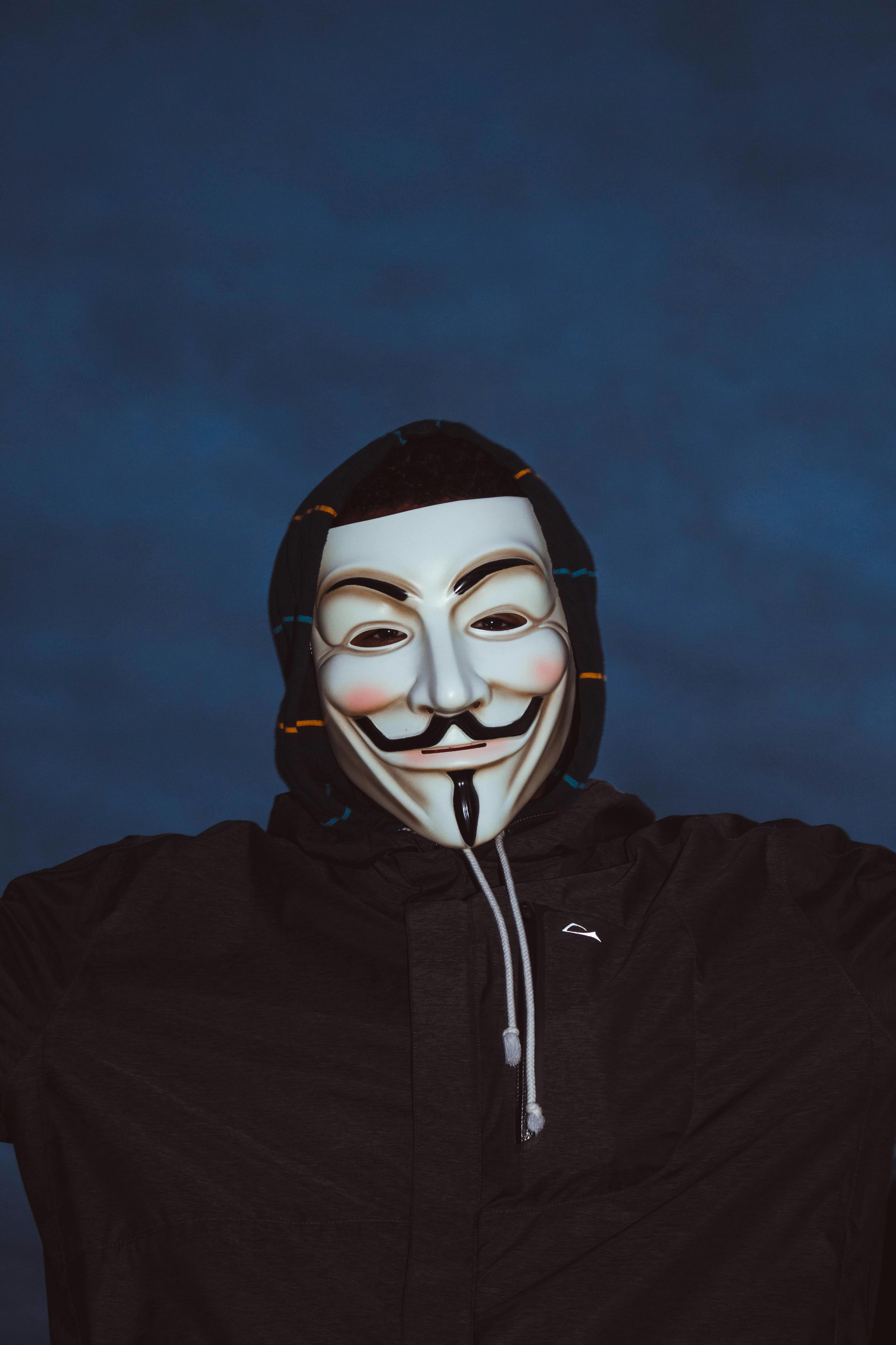 Person in Black Hoodie with Mask · Free Stock Photo