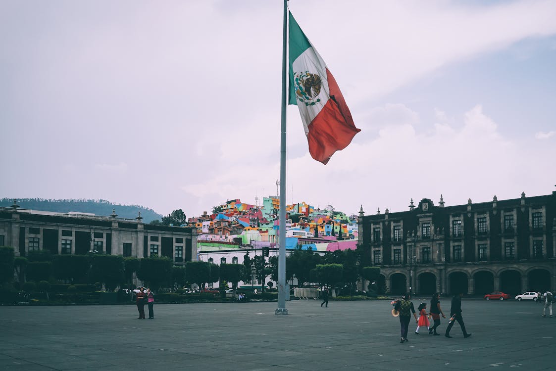 Free People Near Mexican Flag Stock Photo