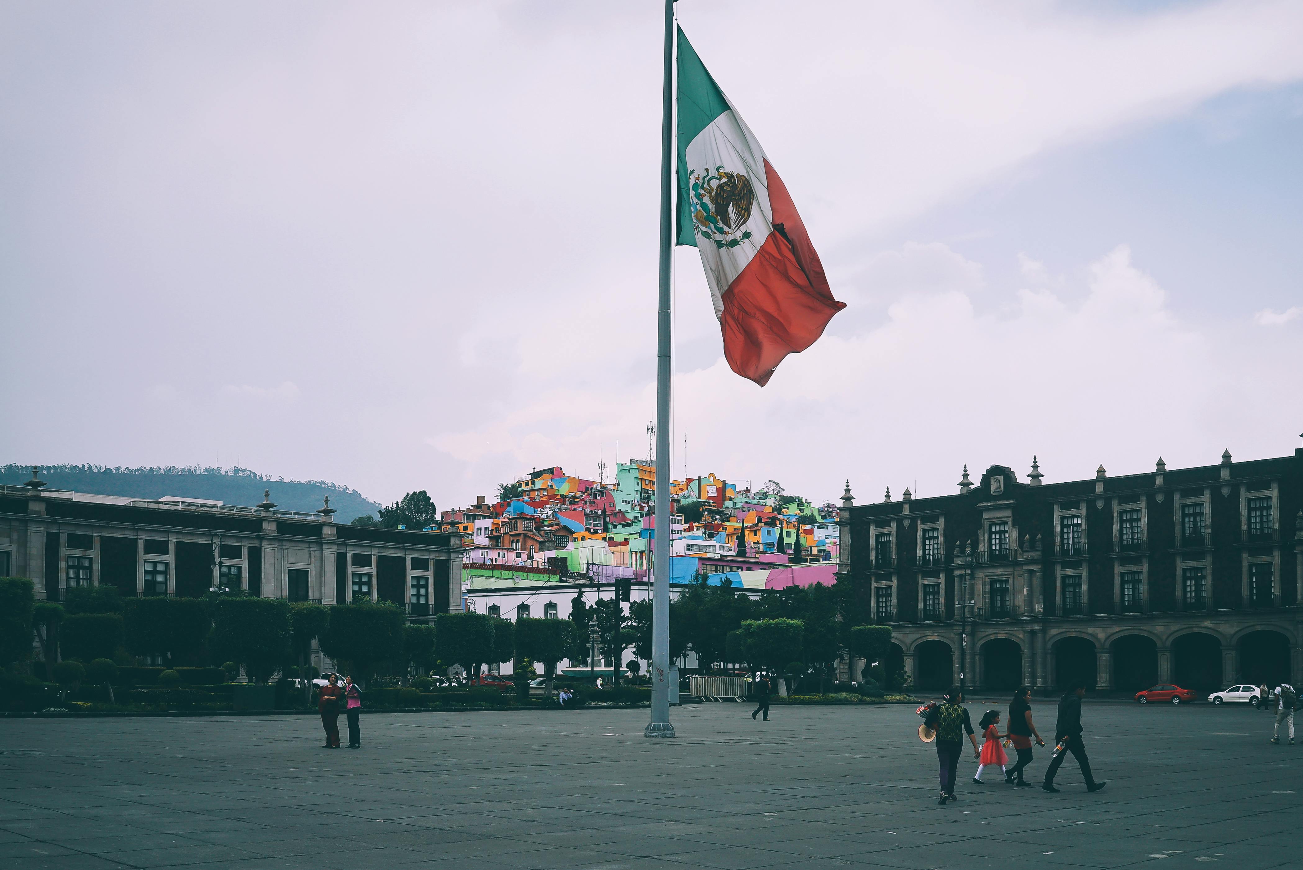 people-near-mexican-flag-free-stock-photo