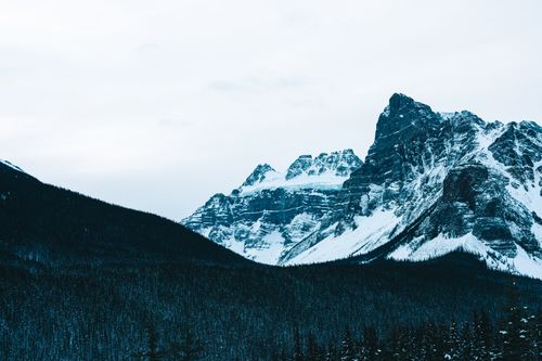 Free Stunning winter view of snow-covered mountains in Banff National Park, Canada. Stock Photo