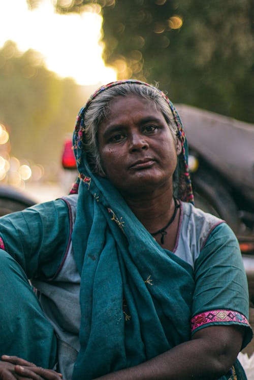 Elderly Woman in Traditional Clothing 