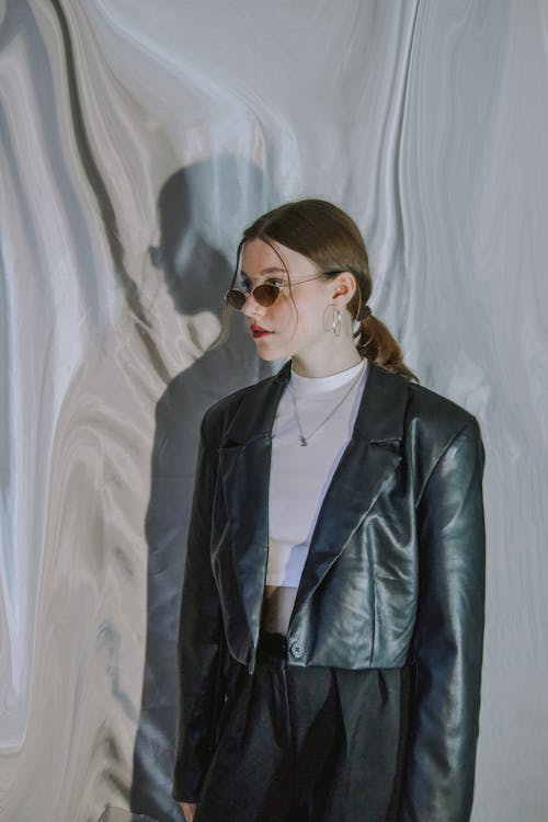 Young Woman in a Leather Jacket and a White Top 