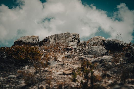 A rugged rocky landscape beneath a dramatic sky in Mérida, Venezuela.