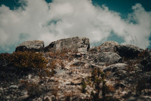 Free Low Angle Shot of Rock Formation under White Clouds in the Sky  Stock Photo