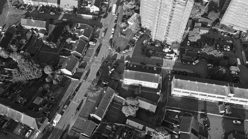 Free Aerial view of urban neighborhood with buildings and streets in black and white. Stock Photo