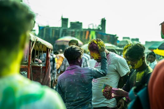 Colorful Holi festival in Delhi, capturing the joyful celebration of colors and community on a lively street.