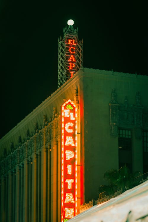 A Neon Sign on a Building in City 