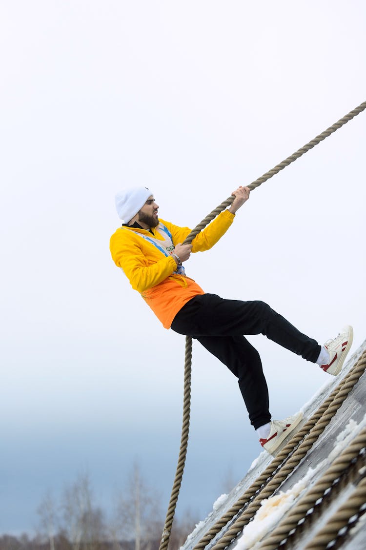 Man Climbing During Competition