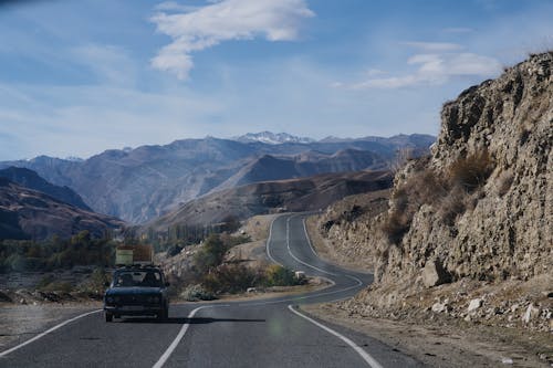 Car Running on Mountain Road