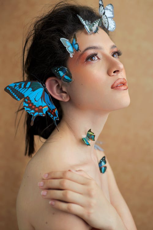 Free Woman with Butterflies on Head Stock Photo