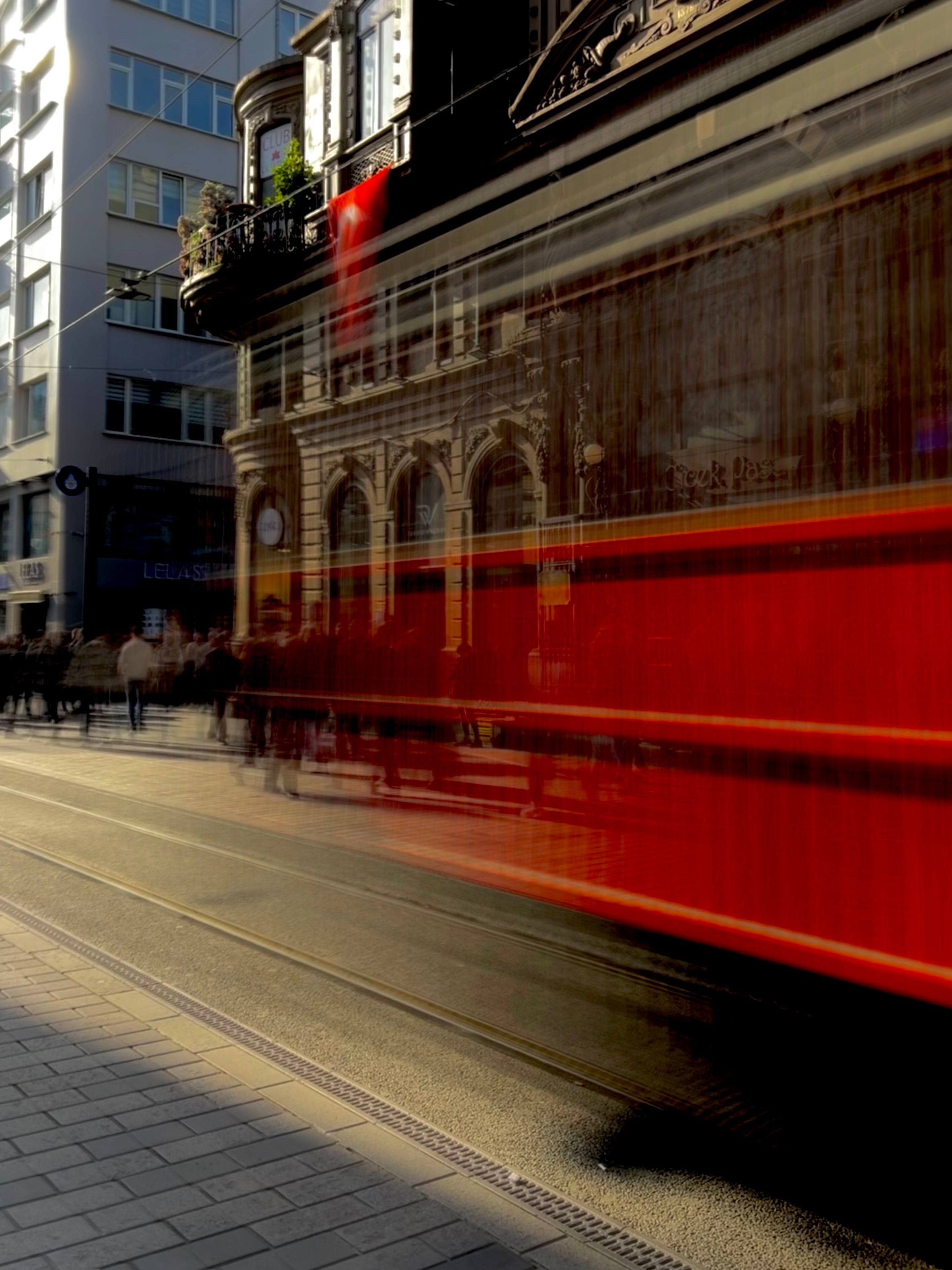 People Walking on Street Near Moving Red Tram · Free Stock Photo