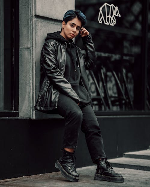 Person in Leather Jacket Posing on Street