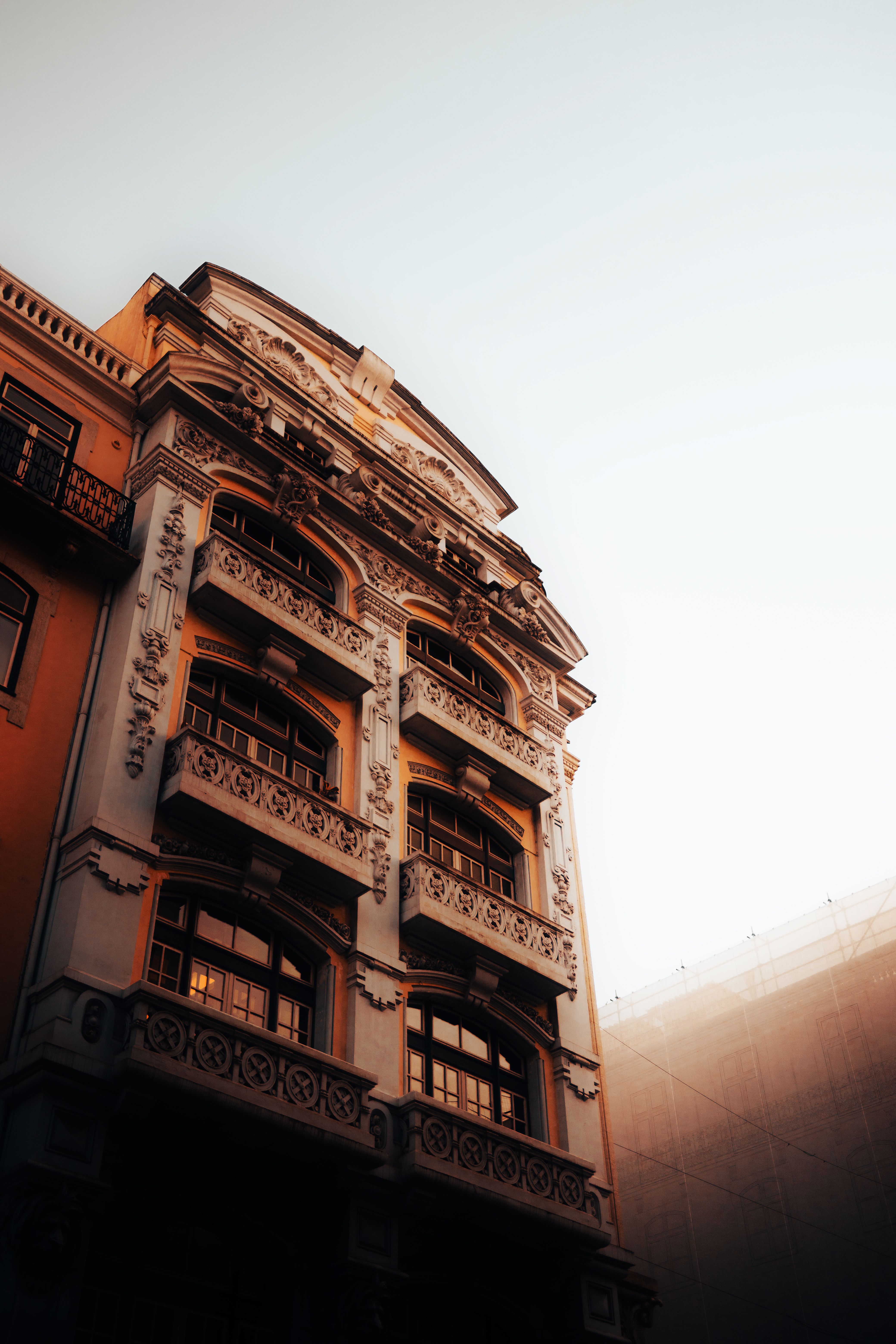 Townhouse facade at sunrise — photo by Darius Krause on Pexels