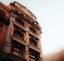 Townhouse facade at sunrise — photo by Darius Krause on Pexels