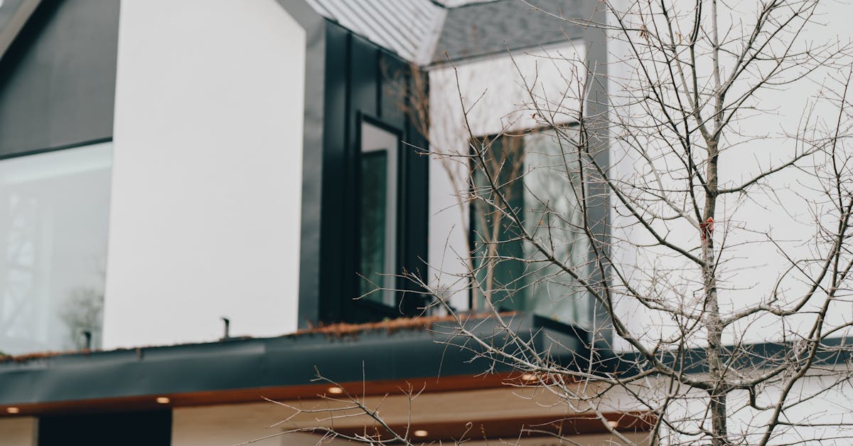 A modern eco-friendly building under construction, with workers using sustainable materials and methods.