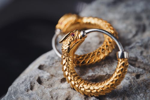 Close-up of Gold Earrings in a Dragon Shape 