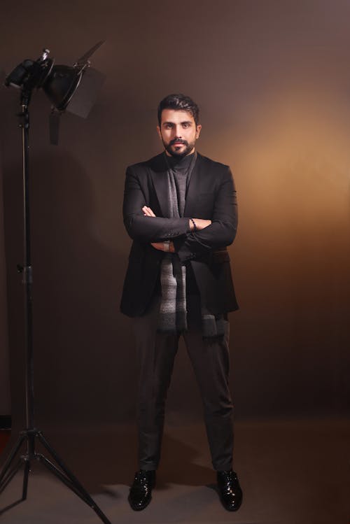 Man in Suit Posing with Arms Crossed