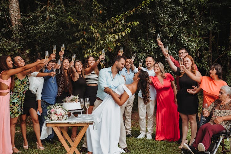 Newlyweds Hugging And People Celebrating