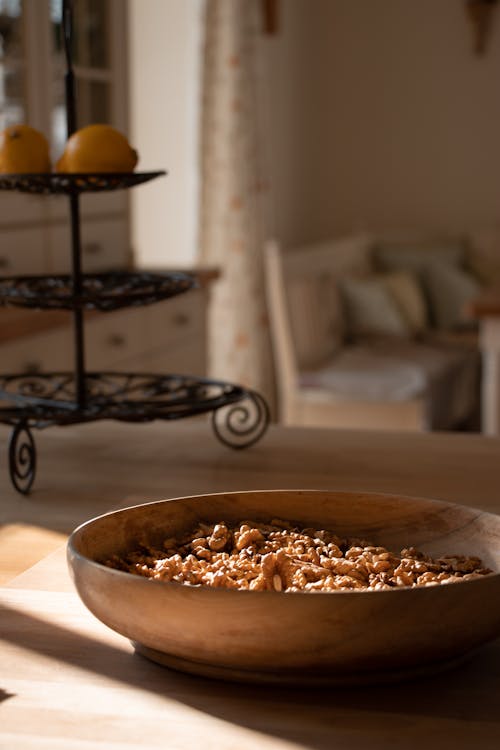 A Bowl with Walnuts Standing on a Kitchen Countertop 