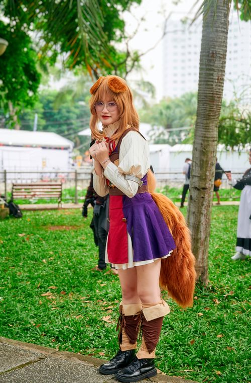 Free Cosplayer dressed as Raphtalia from anime, showcasing detailed costume in a vibrant park setting. Stock Photo