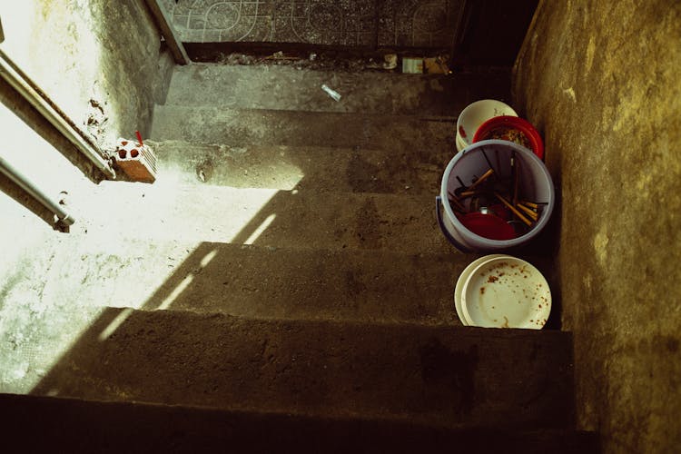 High Angle View Of Plastic Pots On Steps