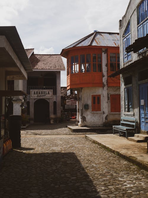 A Cobblestone Alley and Traditional Buildings in a Town 