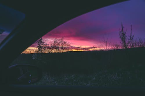 Person Inside Vehicle during Golden Hour