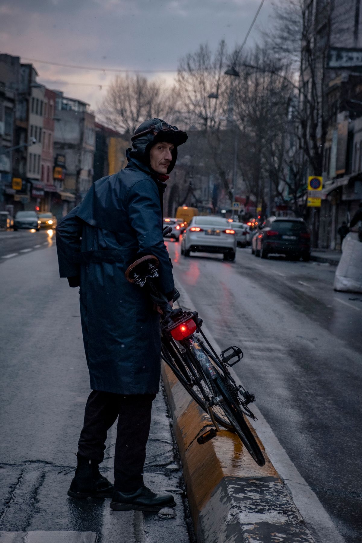 Bicycle commuter riding in wet weather