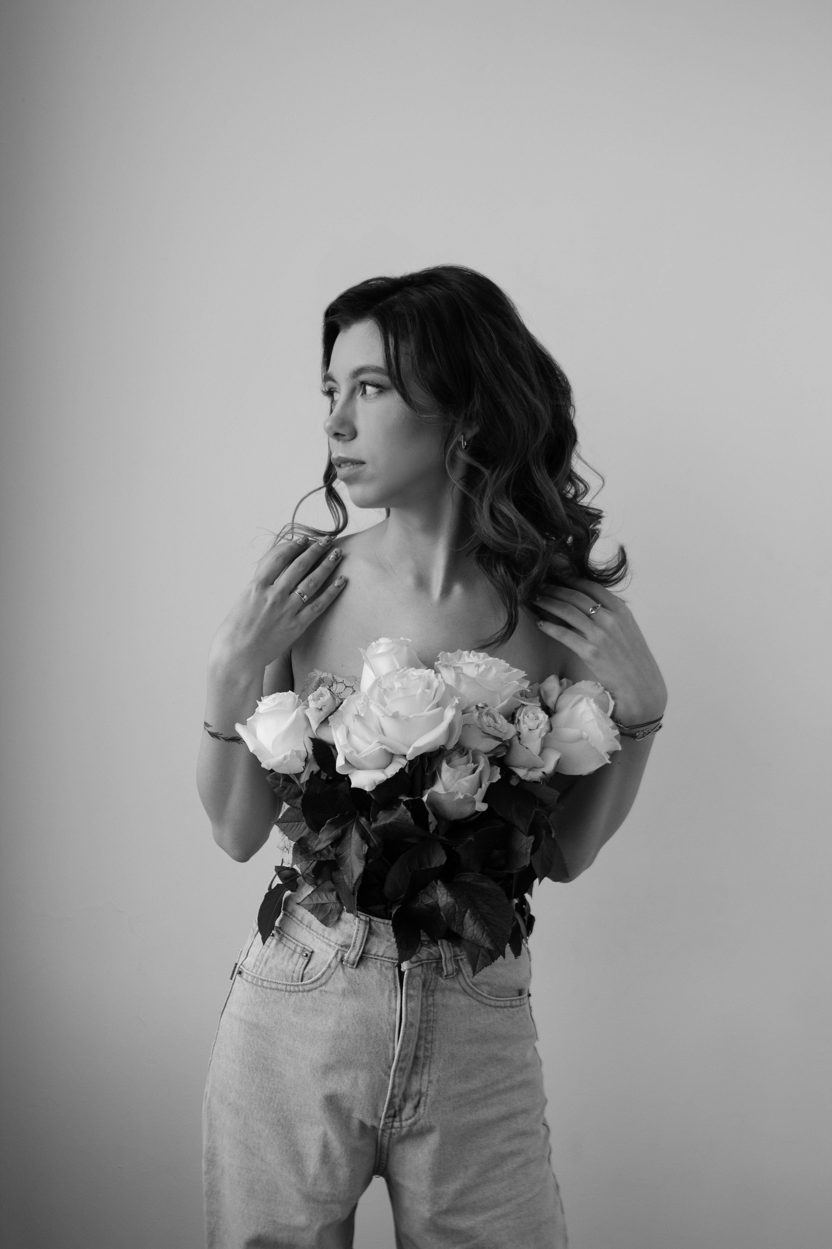 Woman Posing with a Bouquet of Roses · Free Stock Photo