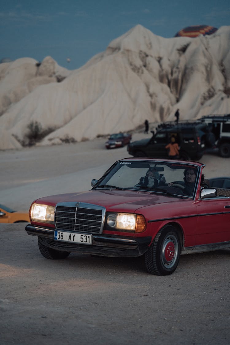 People In Vintage Car