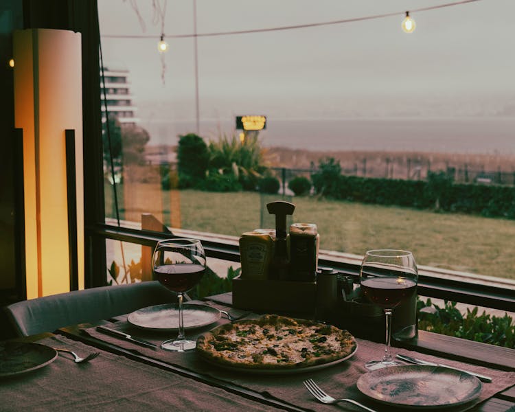 Pizza And Wine On Table