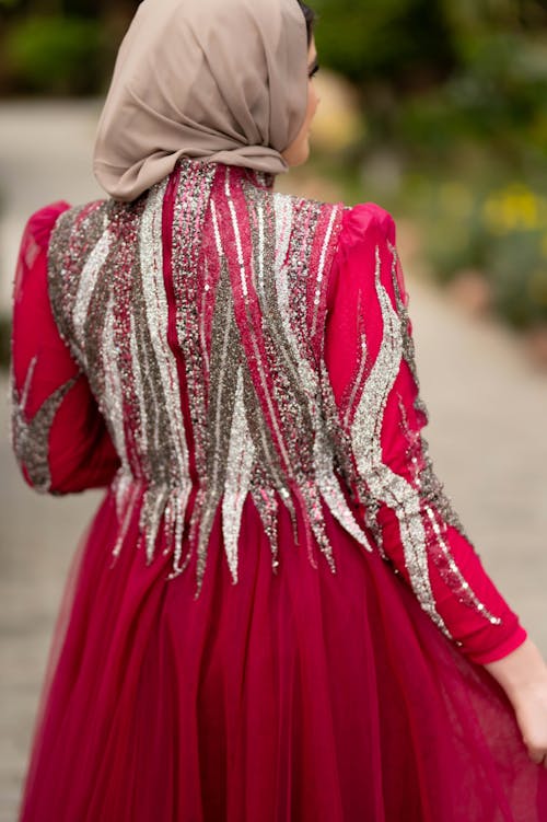 Back View of Woman in Red Dress and Hijab