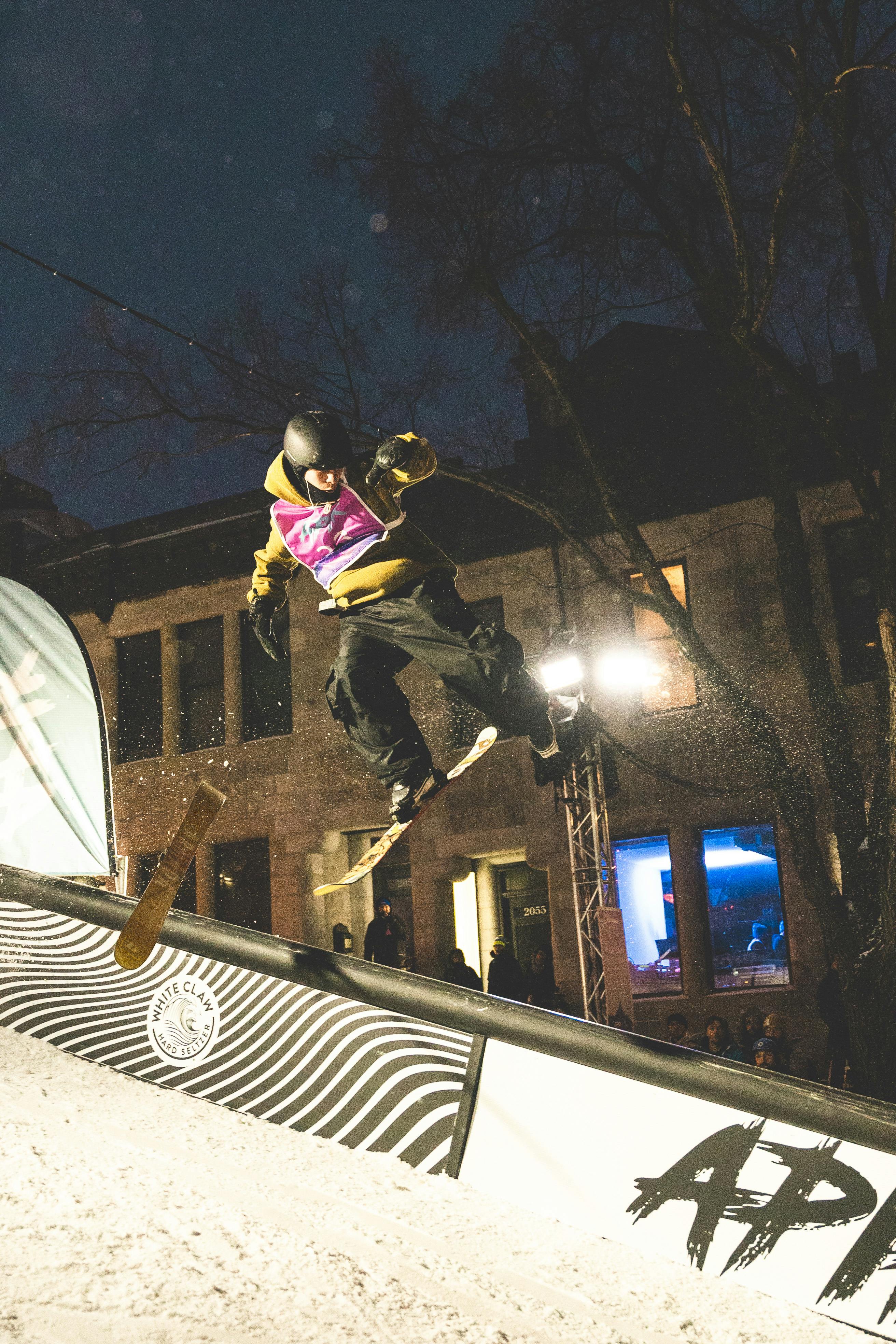 Prescription Goggle Inserts - An action-packed urban ski competition at night showcasing skilled jumps and tricks.