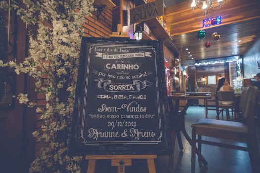 A Board at the Entrance to a Restaurant 
