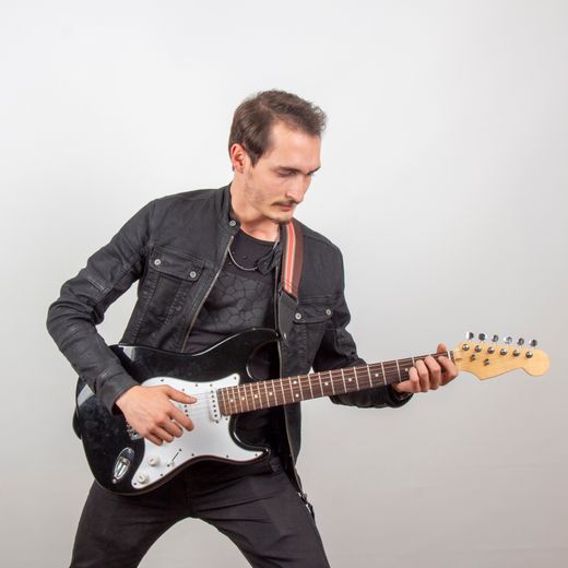 Guitarist mid-performance, photo by Yasin Aydın on Pexels